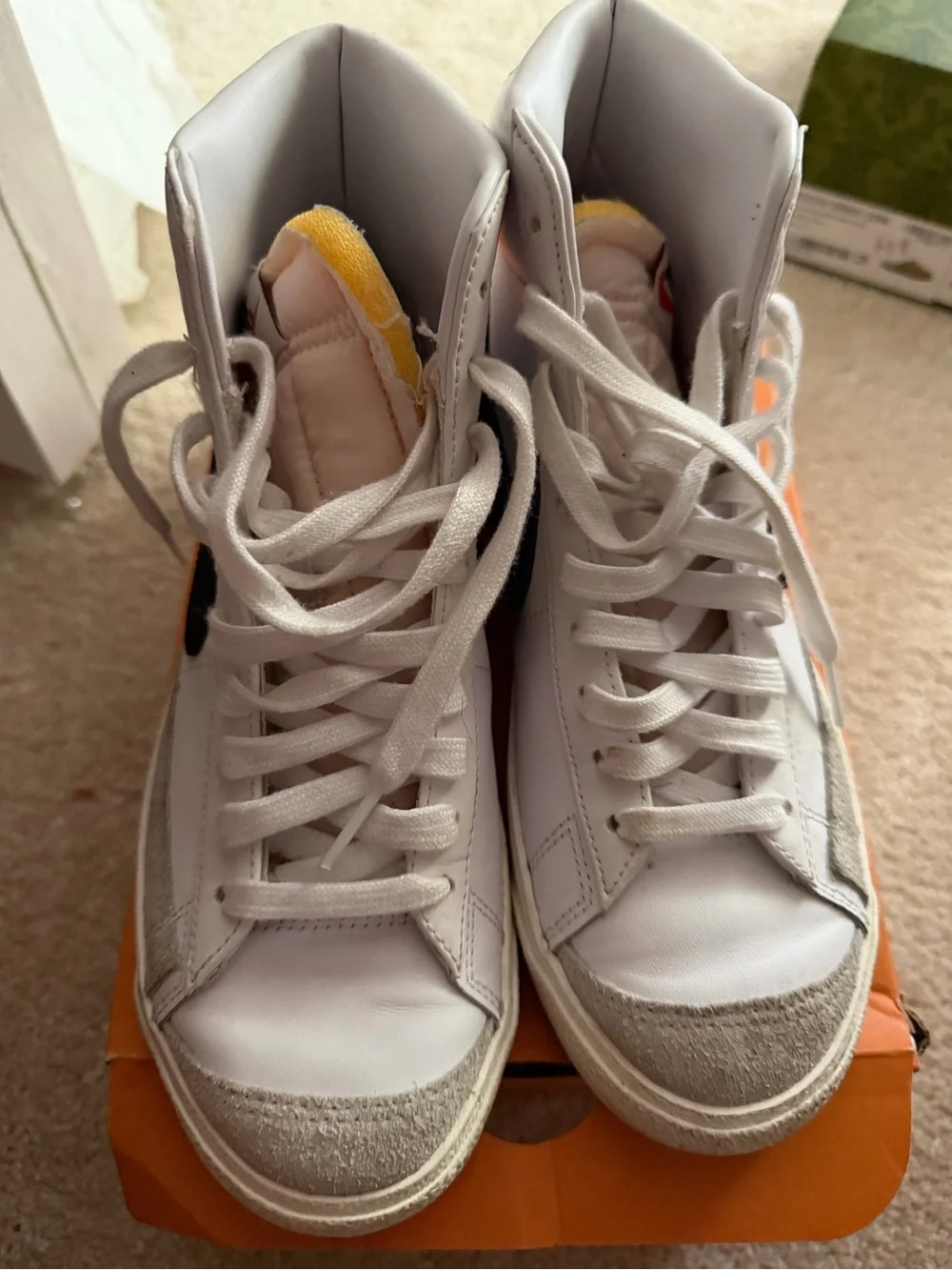 Nike Women’s White High-Top Sneakers with Black Swoosh and Yellow Tongue Accent